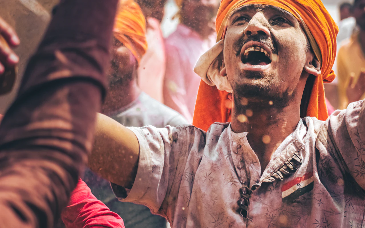 A devotee in an orange turban during a Varanasi celebration