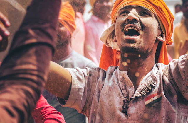 A devotee in an orange turban during a Varanasi celebration