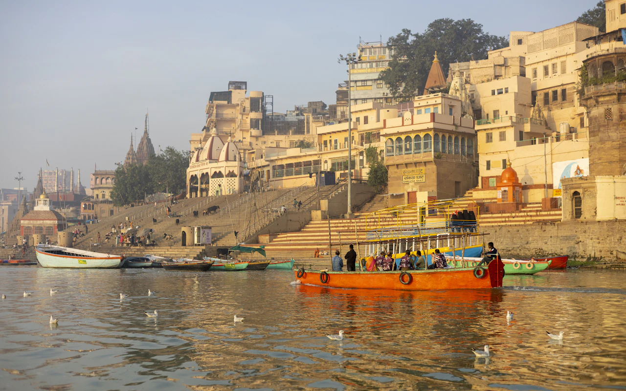 A temple spire above the Ganga at sunset in Varanasi